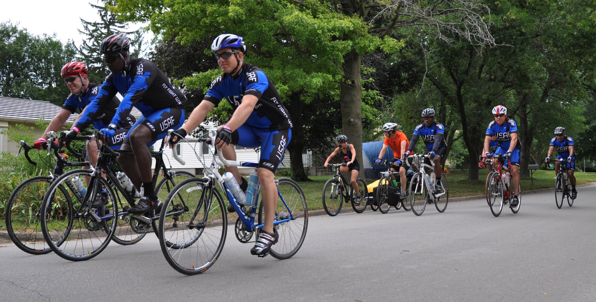 Members of the Air Force Cycling Team ride through Dallas Center, Iowa, as part of the Register's Annual Great Bicycle Ride Across Iowa, July 23, 2013. More than 90 members of the U.S. Air Force joined thousands of bicyclists for the seven-day journey through small towns across Iowa. (U.S. Air Force photo by Staff Sgt. Abigail Klein)