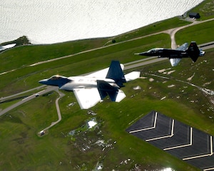 U.S. Air Force and Navy units participated in the Trident Warrior 2013 exercise over the Atlantic Ocean near the Hampton Roads, Va., area, July 8-19. The exercise helped keep the participating pilots versatile and laid the ground work for future joint operations. (U.S. Air Force photo by Staff Sgt. John D. Strong II / Released)