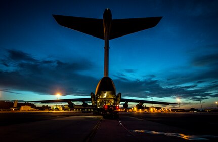 Cargo is loaded onto a West Virginia  Air National Guard C-5 Galaxy from Martinsburg, W. Va., July 22, 2013, at Joint Base Charleston – Air Base, S.C. The cargo is being used to assist operation Enduring Freedom. The C-5 is one of the largest aircraft in the world and the largest airlifter in the Air Force inventory. (U.S. Air Force photo/ Senior Airman Dennis Sloan)