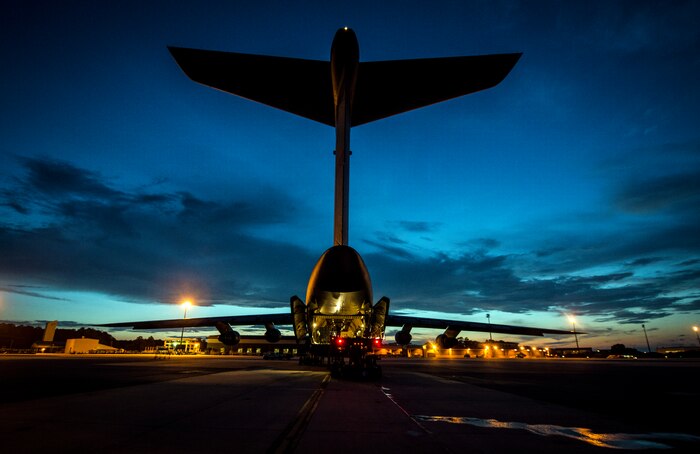 Cargo is loaded onto a West Virginia  Air National Guard C-5 Galaxy from Martinsburg, W. Va., July 22, 2013, at Joint Base Charleston – Air Base, S.C. The cargo is being used to assist operation Enduring Freedom. The C-5 is one of the largest aircraft in the world and the largest airlifter in the Air Force inventory. (U.S. Air Force photo/ Senior Airman Dennis Sloan)
