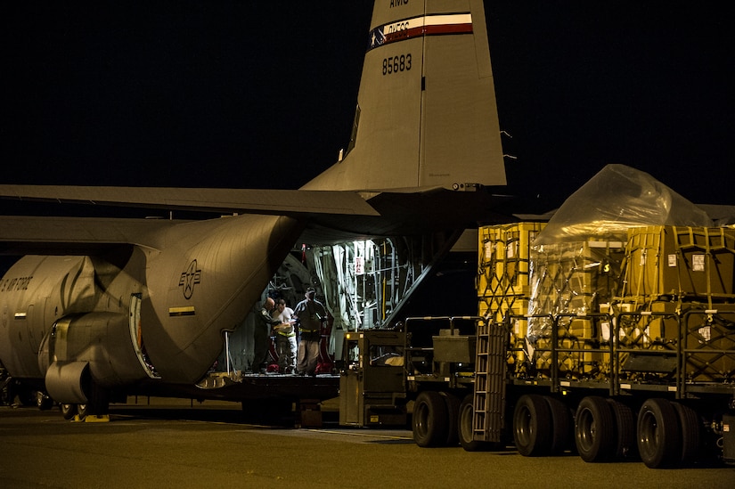 Staff Sgt. Kenneth Hulsey, 437th Aerial Port Squadron ramp service supervisor, drives a K-loader towards a C-130J-30 from Dyess Air Force Base, Texas, during an early morning cargo load July 23, 2013, at Joint Base Charleston - Air Base, S.C. The C-130J-30 was loaded with rations and supplies bound for Bogota. The C-130J-30 is a stretch version of the C-130J, a proven, highly reliable and affordable airlifter. The C-130J-30 adds 15 feet to the fuselage, increasing usable space in the cargo compartment. (U.S. Air Force photo/ Senior Airman George Goslin)