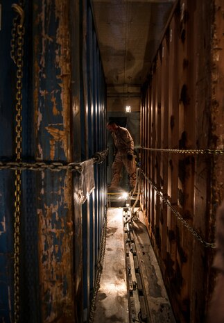 Master Sgt. David Martens, West Virginia Air National Guard member, 167th Maintenance Squadron C-5 Galaxy load master from Martinsburg, W. Va., straps down cargo on a C-5 July 22, 2013, at Joint Base Charleston – Air Base, S.C. The cargo is being used to assist operation Enduring Freedom. The C-5 is one of the largest aircraft in the world and the largest airlifter in the Air Force inventory. (U.S. Air Force photo/ Senior Airman Dennis Sloan)