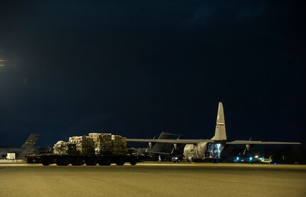 A C-130J-30 from the 317th Airlift Group, Dyess Air Force Base, Texas, waits to be loaded during an early morning cargo load July 23, 2013, at Joint Base Charleston - Air Base, S.C. The C-130J-30 was loaded with rations and  supplies bound for Bogota. The C-130J-30 is a stretch version of the C-130J, a proven, highly reliable and affordable airlifter. The C-130J-30 adds 15 feet to the fuselage, increasing usable space in the cargo compartment. (U.S. Air Force photo/ Senior Airman George Goslin)