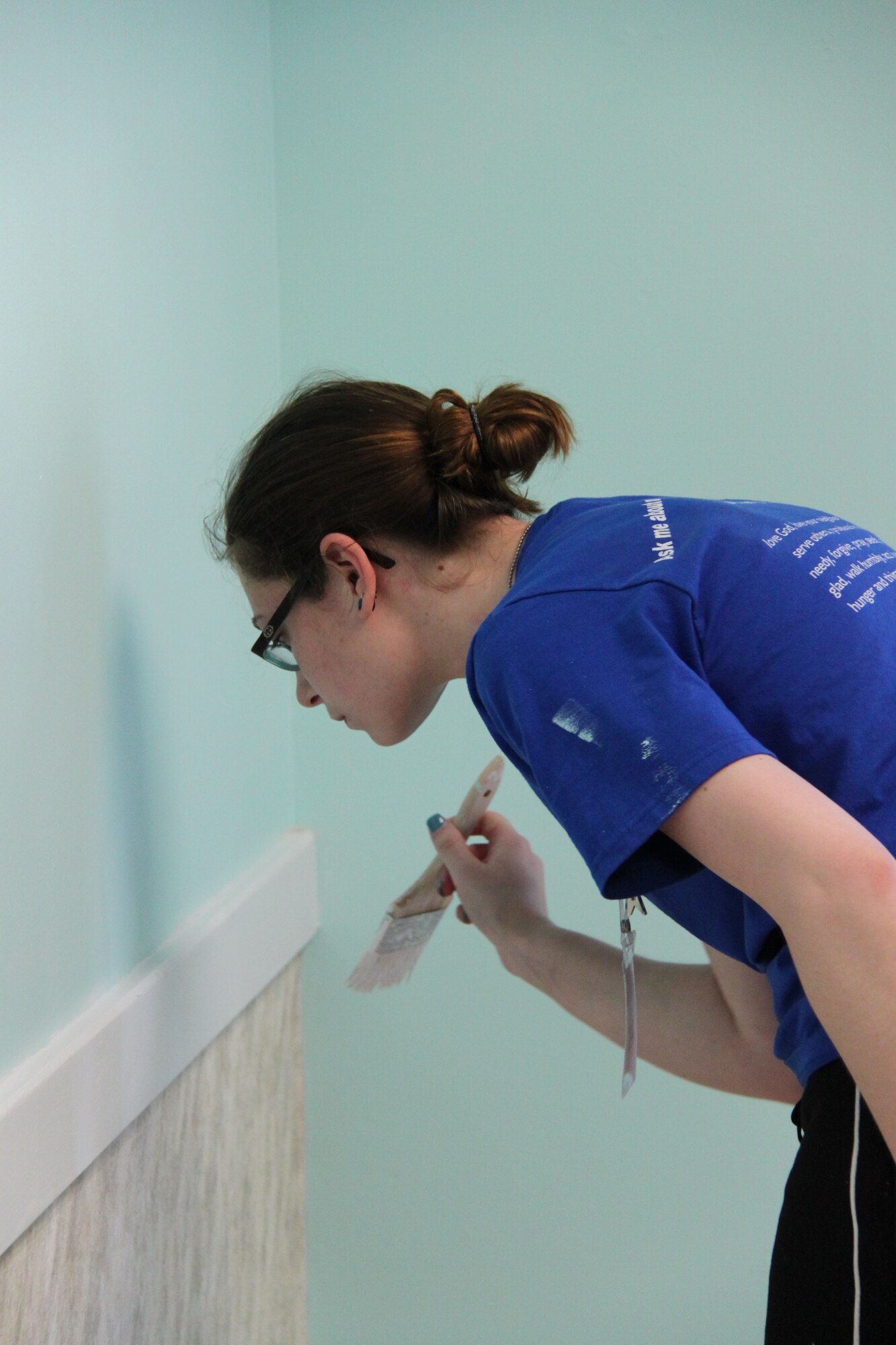 A volunteer paints at the main child development center on Hurlburt Field, Fla. during the annual mission trip.
 (courtesy photo)