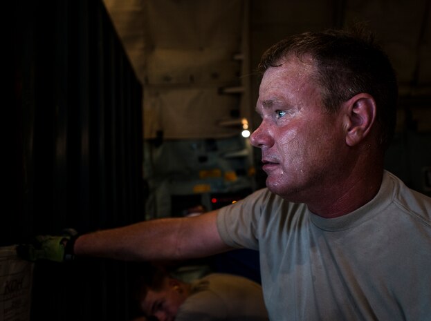 Master Sgt. John Elder, West Virginia Air National Guard member, 167th Maintenance Squadron C-5 Galaxy load master from Martinsburg, W. Va., waits to push a load of cargo into place on a C-5 July 22, 2013, at Joint Base Charleston – Air Base, S.C. The cargo is being used to assist operation Enduring Freedom. The C-5 is one of the largest aircraft in the world and the largest airlifter in the Air Force inventory. (U.S. Air Force photo/ Senior Airman Dennis Sloan)