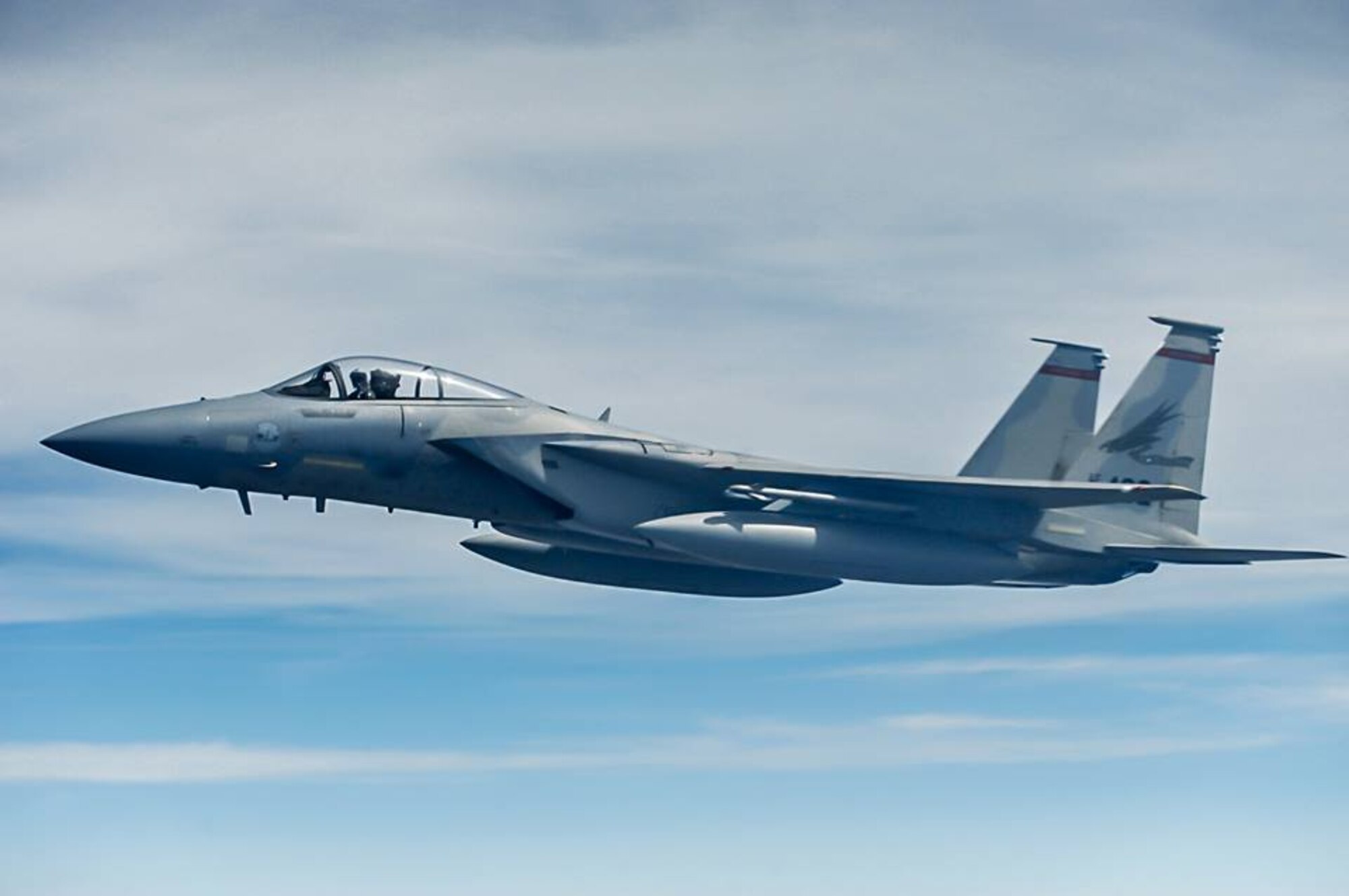 An F-15 Eagle, from the 142nd Fighter Wing, Oregon Air National Guard, flies over northeast Kansas after receiving fuel from a KC-135 Stratotanker assigned to McConnell Air Force Base, Kan., July 23, 2013. Eight F-15s received fuel from a three-ship tanker sortie during the mission. McConnell has 62 KC-135s, which provide global reach by conducting air refueling and airlift where and whenever needed. (U.S. Air Force photo/ Staff Sgt. Jess Lockoski)
