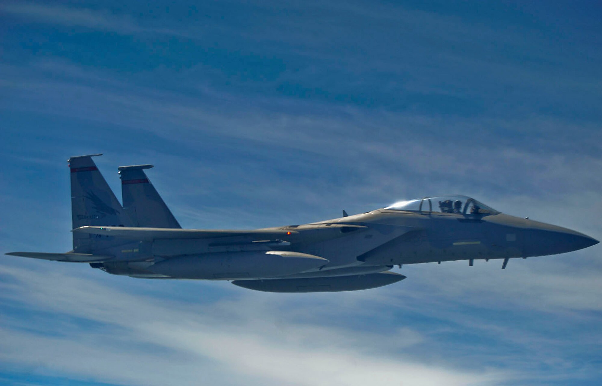 An F-15 Eagle, from the 142nd Fighter Wing, Oregon Air National Guard, Portland, Ore., flies over northeast Kansas after receiving fuel from a KC-135 Stratotanker assigned to McConnell Air Force Base, Kan., July 23, 2013. Eight F-15s received fuel from a three-ship tanker sortie during the mission. McConnell AFB has 62 KC-135s, which provide global reach by conducting air refueling and airlift where and whenever needed. (U.S. Air Force photo/ Staff Sgt. Jess Lockoski)