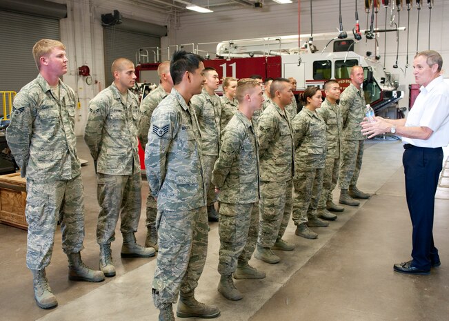 Retired Chief Master Sgt. Eric Benken, the 12th Chief Master Sergeant of the Air Force,, talks with members of the 99th Logistics Readiness Squadron Vehicle Maintenance Flight July 19, 2013, during an orientation visit to Nellis Air Force Base, Nev. Benken visited several locations at Nellis AFB including the Airman Leadership School, the 57th Aircraft Maintenance Squadron Lightning Aircraft Maintenance Unit and the 99th LRS. (U.S. Air Force photo by Staff Sgt. Michael Charles)