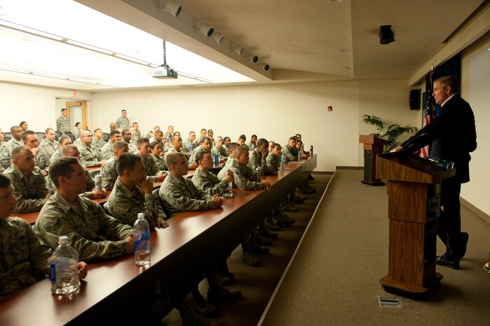 Retired Chief Master Sgt. Eric Benken, the 12th Chief Master Sergeant of the Air Force, talks with 99th Force Support Squadron Airman Leadership School class 13-F students during an orientation July 19, 2013, at Nellis Air Force Base, Nev. Benken discussed airmanship and took questions from students about his road to becoming the senior ranking enlisted member in the Air Force. (U.S. Air Force photo by Staff Sgt. Michael Charles)