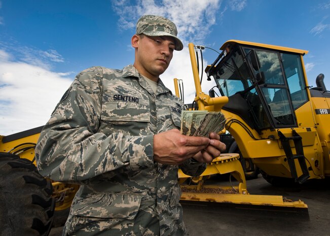 Staff Sgt. Joseph Senteno, 99th Civil Engineer Squadron budget analyst, manages finances and budgeting for various projects and programs at Nellis Air Force Base, Nev. Methods he implemented as a financial analyst significantly reduced man hours and saved unused funds. (U.S. Air Force photo by Airman 1st Class Jason Couillard)
