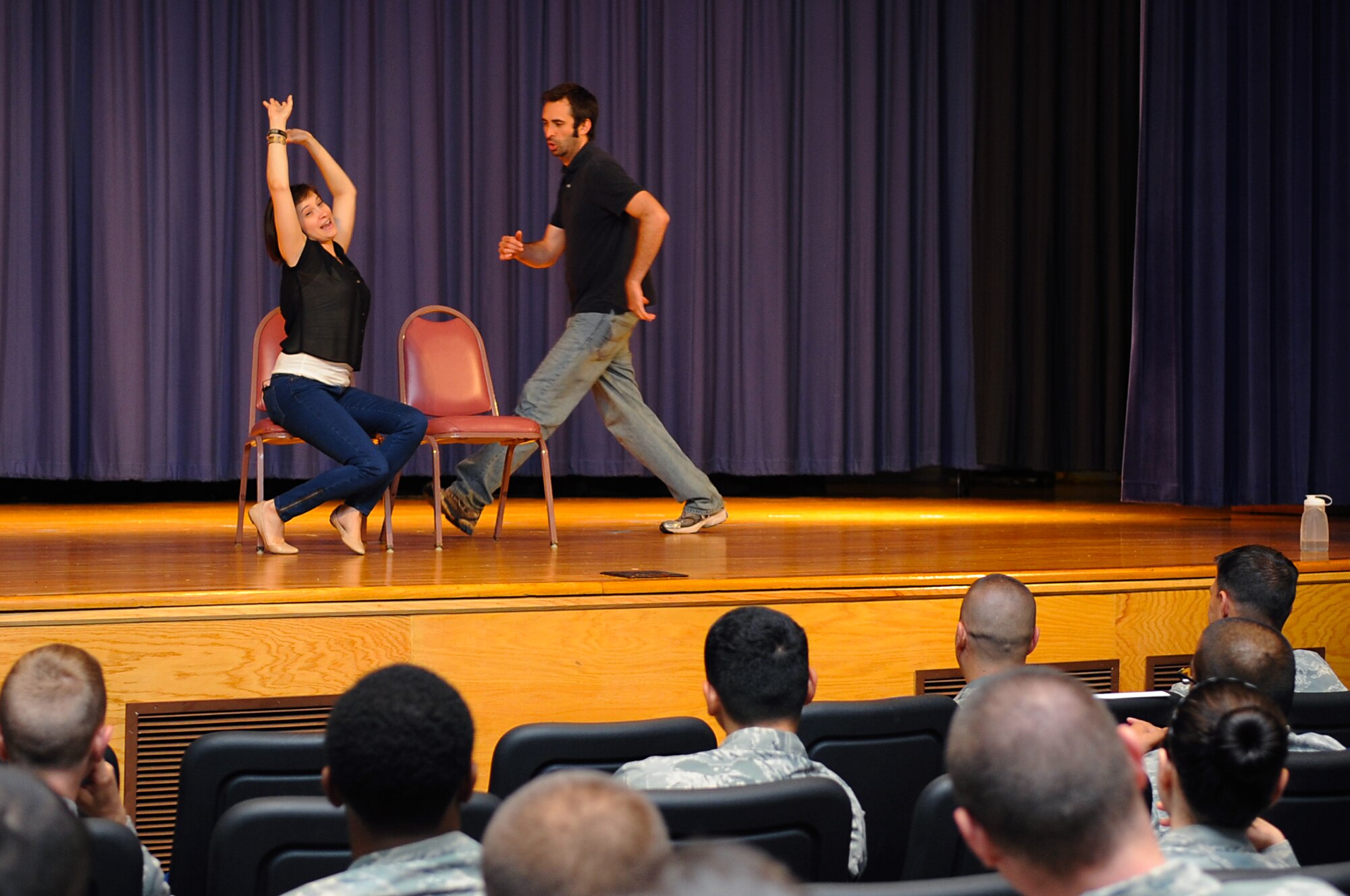 U.S. Air Force Airmen watch a performance of “Sex Signals,” an interactive improv play, at Langley Air Force Base, Va., July 22, 2013. During the “We are Family” campaign, Service members were challenged to reexamine a culture that, too often, holds victims of rape responsible for their actions. (U.S. Air Force photo by Airman 1st Class Victoria H. Taylor/Released)