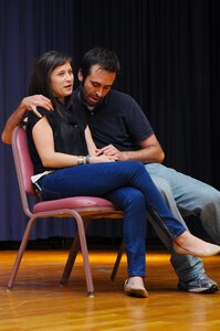 Annie Rix and Brian Golden, “Sex Signals” presenters, perform a skit during the improvisational comedy show at Langley Air Force Base, Va., July 22, 2013. Since 2000, “Sex Signals” has been introduced to more than 1.2 million people with the actors performing appoximately 4000 shows. (U.S. Air Force photo by Airman 1st Class Victoria H. Taylor/Released)