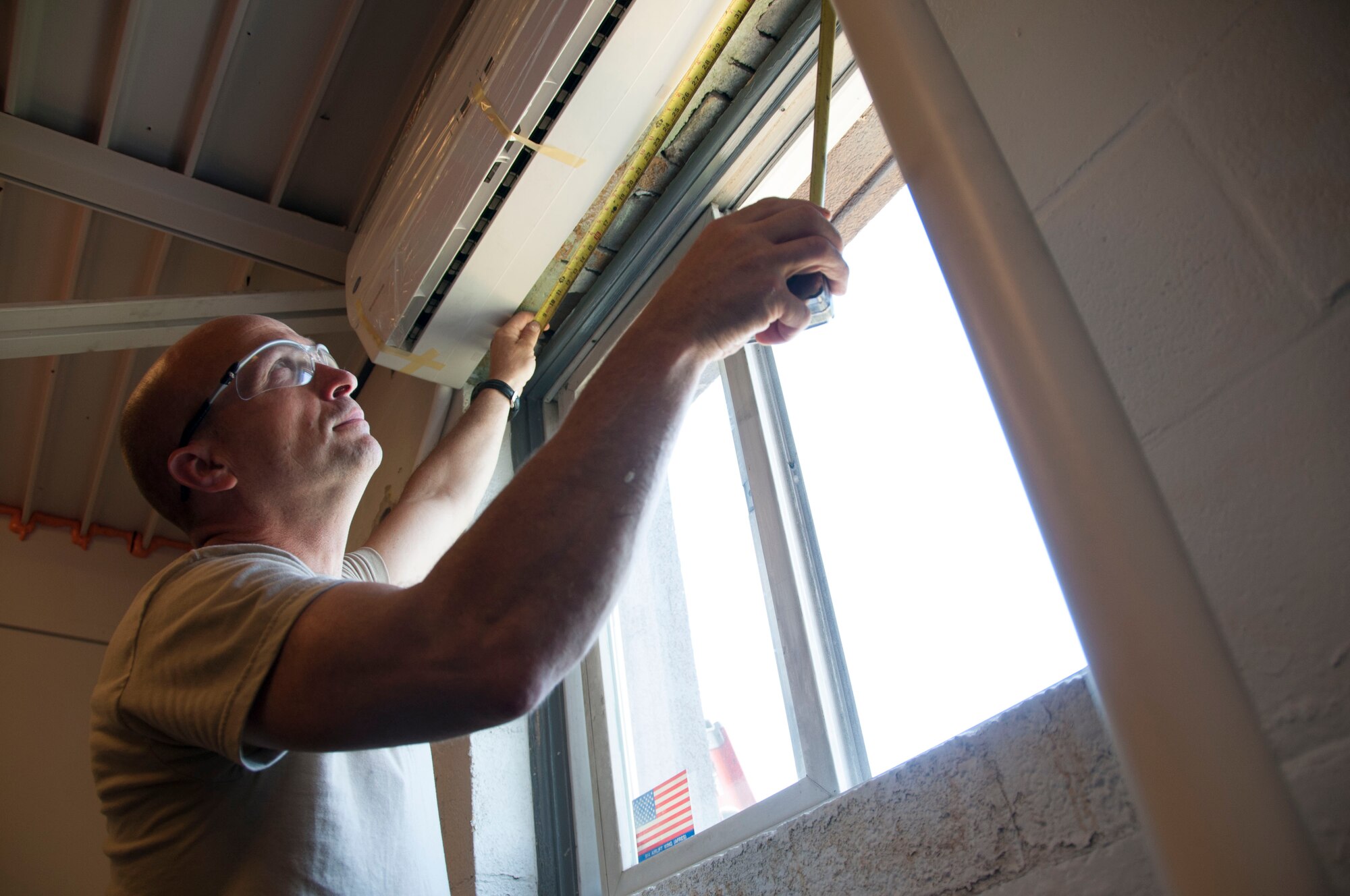 914th Civil Engineer Tech. Sgt. Terry Oathout inspects the newly installed heating and air conditioning unit in the 30th Aerial Port Squadron building at the Niagara Falls Air Reserve Station, N.Y. July 19. More than 20 Airmen of the 914th Civil Engineering Squadron repaired and updated installtion buildings during their two weeks of annual training here. (U.S. Air Force photo by Tech. Sgt. Joseph McKee)