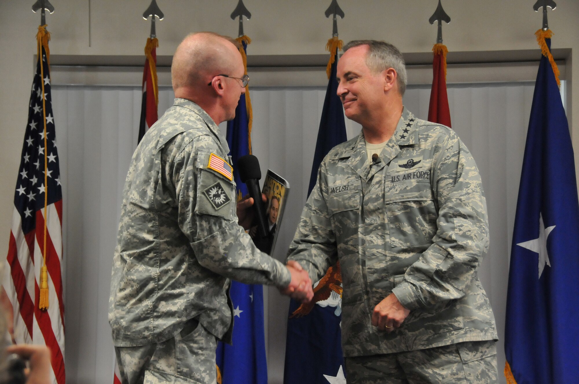 Air Force Chief of Staff Gen. Mark A. Welsh III shakes hands with Maj. Gen. K. Luke Reiner, Wyoming's adjutant general, after addressing Airmen of the 153rd Airlift Wing, Wyoming Air National Guard, during an Airman'scall July 19, 2013 in Cheyenne, Wyo. Welsh thanked the 153rd AW, discussed Air Force priorities and answered questions from the audience. (U.S. Air National Guard photo by Senior Airman Nichole Grady)