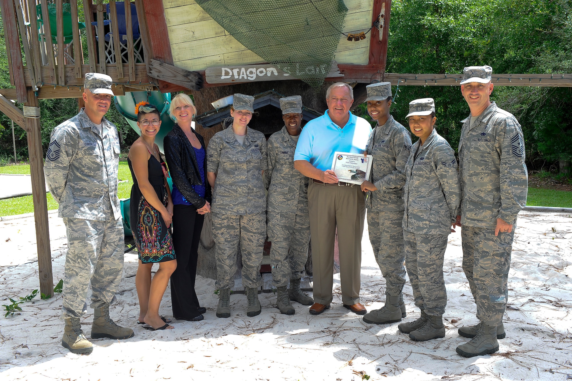 Chief Master Sgt. Jeff Maberry, command chief of 1st Special
Operations Wing, far right, accompanies Hurlburt Airmen as they present
certificates of appreciation to volunteers while at the Air Force Enlisted
Village in Shalimar, Fla., July 16, 2013.  Retired Chief Master Sgt. James
Binnicker, the ninth Chief Master Sergeant of the Air Force and AFEV CEO,
fourth from right, was on hand to recognize volunteers who raised $350 to
benefit AFEV residents. (U.S. Air Force Photo / Airman 1st Class Jeffrey
Parkinson)  
