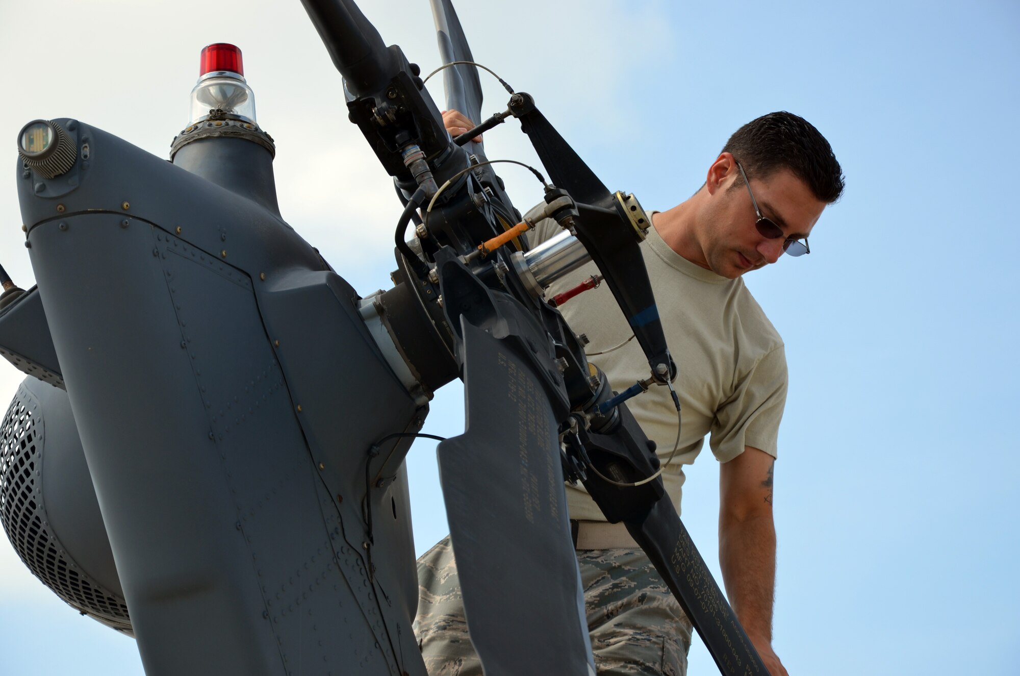 Tech. Sgt. Jeffery Cope, 920th Maintenance Group, checks the tail rotor on an HH-60G Pave hawk helicopter at Patrick Air Force Base, Fla., July 24, 2013. Cope and fellow maintenance Airmen in the group use an innovative tracking system for all training including pre-deployment. (U.S. Air Force photo/Tech. Sgt. Anna-Marie Wyant)