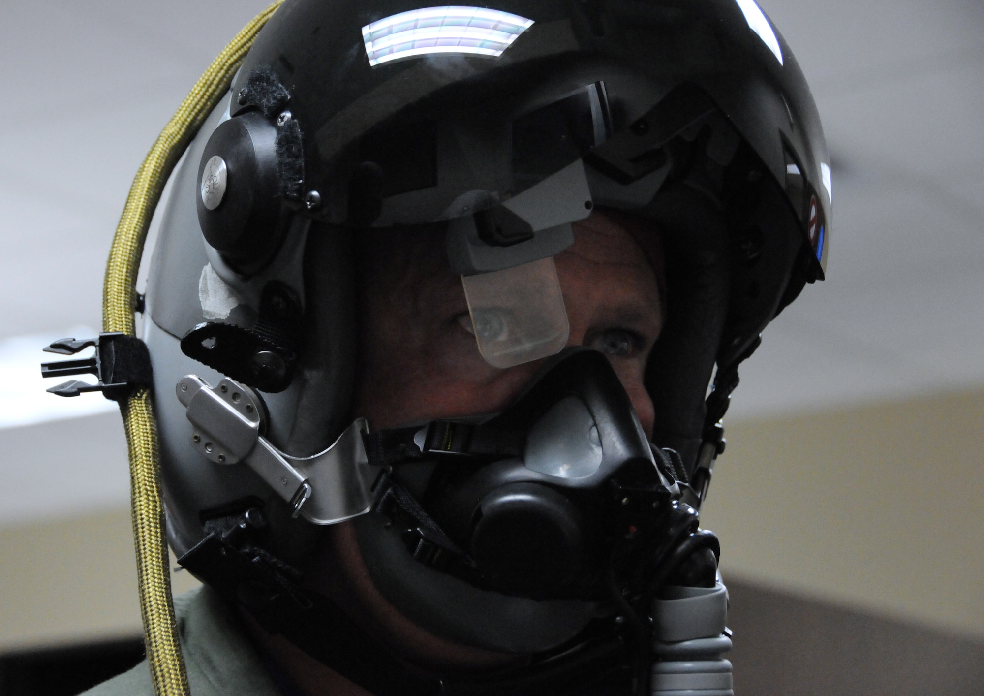 Maj. Robert Lytle, 93rd Fighter Squadron director of operations and F-16 pilot, tests the Helmet Mounted Integrated Targeting unit at Homestead Air Reserve Base, Fla., July 17. HMIT, currently being fielded at Homestead ARB, is an avionics system that gives the pilot the ability to cue a weapon against a target simply by looking at it anywhere in the cockpit. (U.S. Air Force photo/Ross Tweten) 