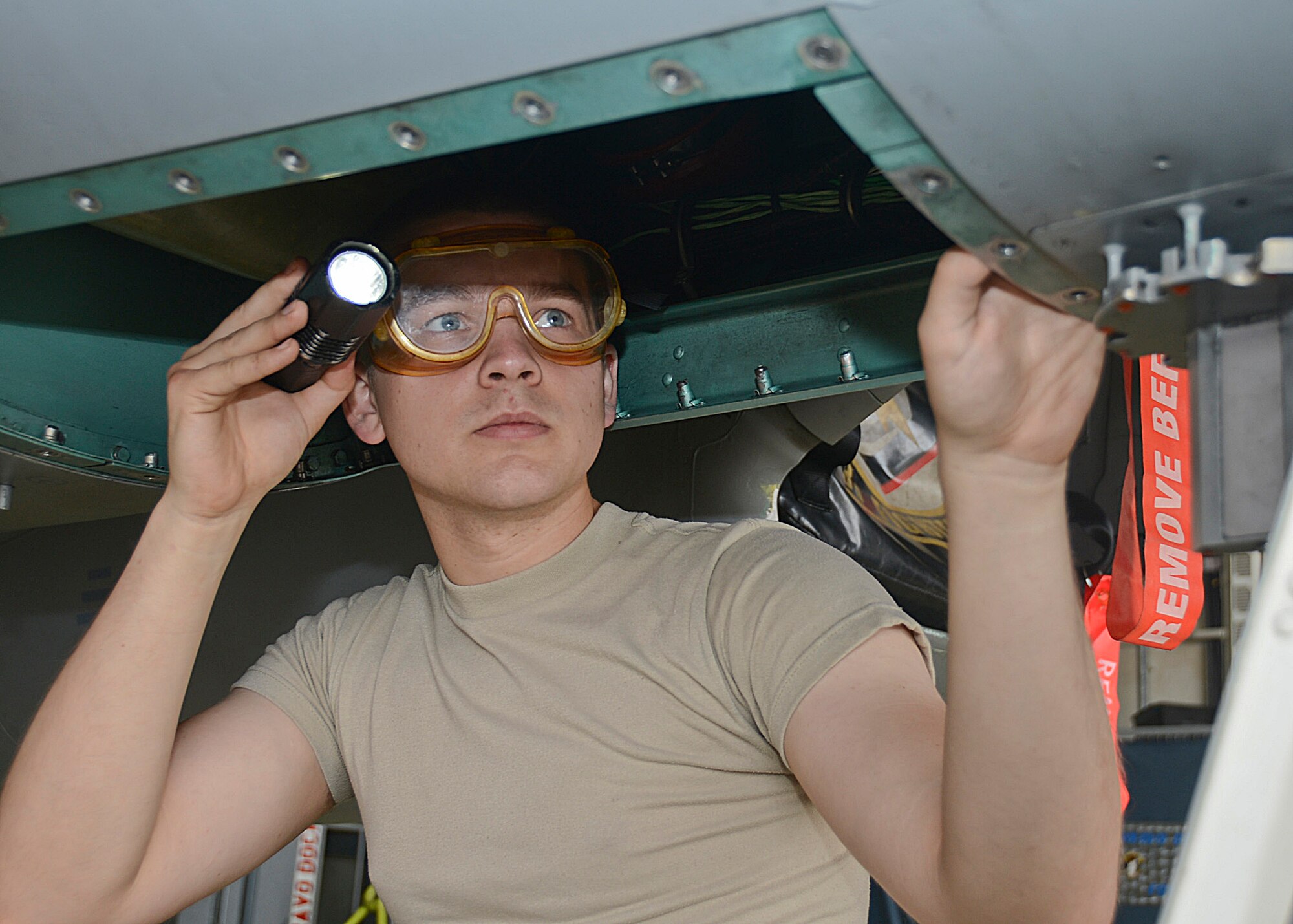Airman 1st Class Joshua Shafer, 48th Component Maintenance Squadron aircraft electrical and environmental systems journeyman, performs a wire inspection at Royal Air Force Lakenheath, England, July 24, 2013. Shafer was nominated for a Liberty Spotlight because he displays the core value of “Excellence in All We Do.” (U.S. Air Force photo by Airman 1st Class Trevor T. McBride)  