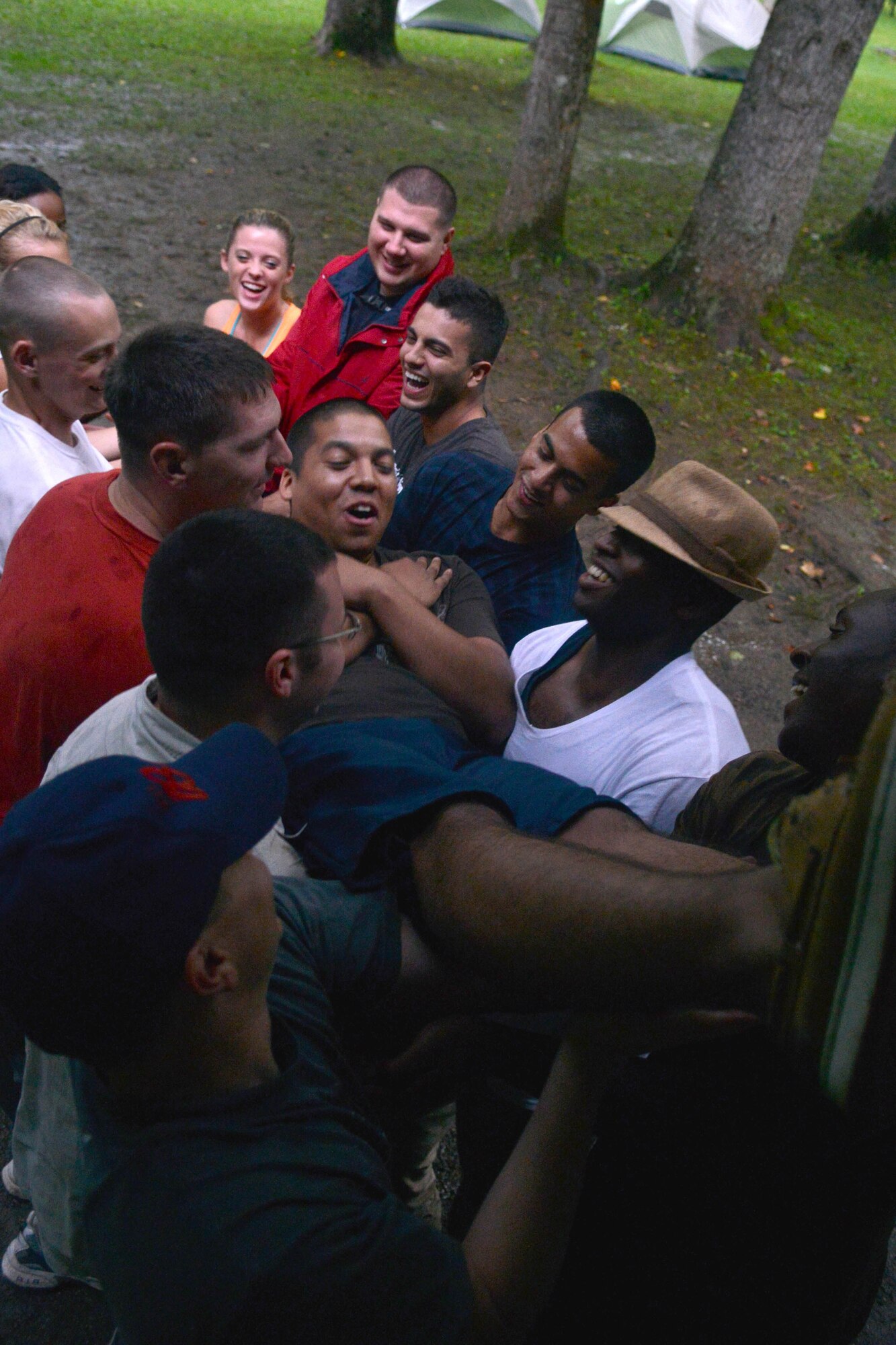 U.S. Air Force Staff Sgt. Alejandro Serna, 20th Fighter Wing NCOIC of program support, lands into the arms of Airmen during a trust fall, Bryson City, N.C., July 21, 2013. The Shaw Air Force Base chapel sponsored the out of- town opportunity for Team Shaw single service members to focus on resiliency, physical challenge and social growth. . (U.S. Air Force photo by Airman 1st Class Ashley L. Gardner/Released)