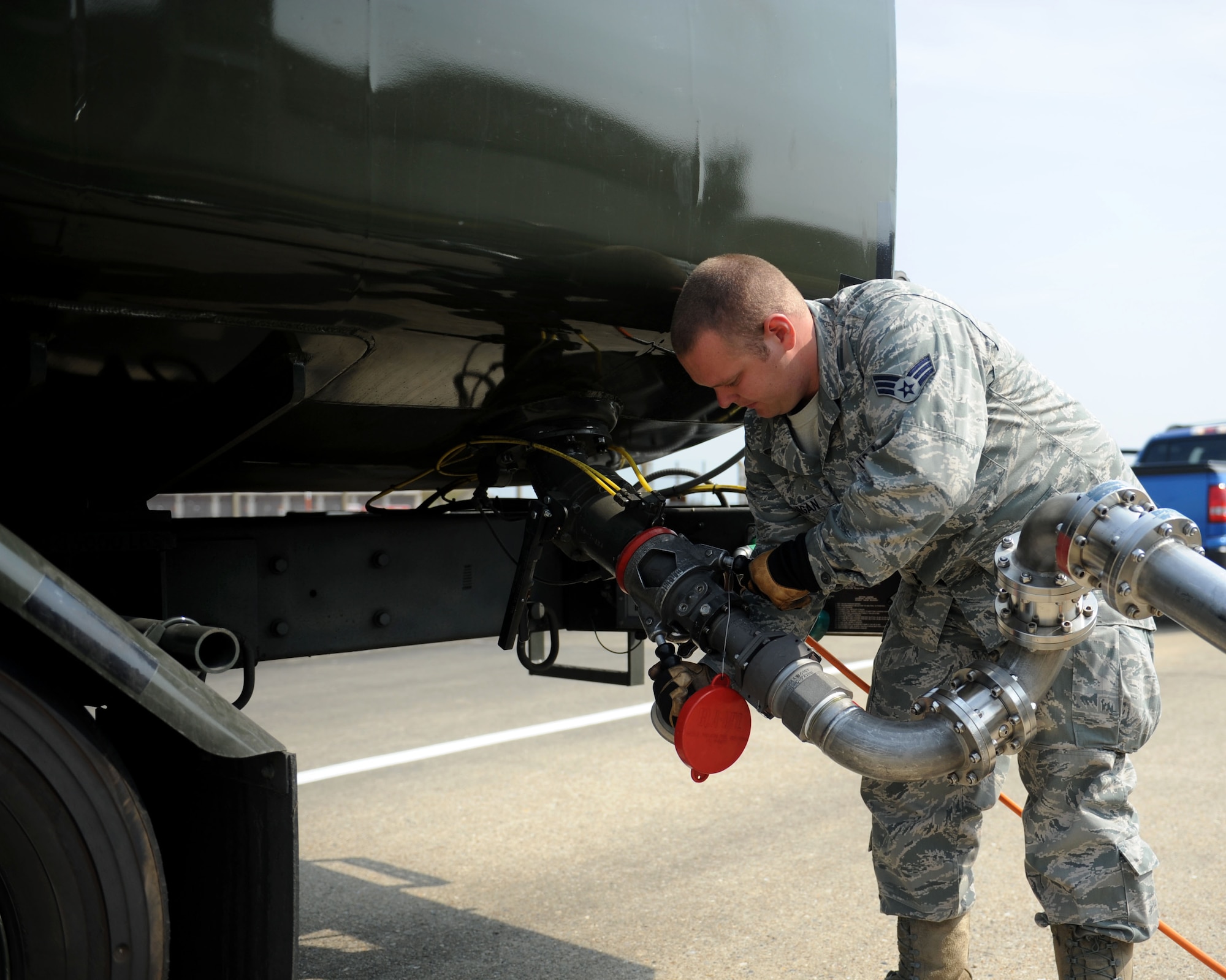 Senior Airman Casey Jernigan from Pontotoc, Miss., 100th Logistics Readiness Squadron Fuels Distribution operator, connects a pantograph to an R-11 refueling truck July 22, 2013, on RAF Mildenhall, England. A pantograph is a set of mobile pipes which connects aircraft or equipment, such as refueling trucks, to a fuel-hydrant system. On RAF Mildenhall, R-11 refueling trucks are used to refuel aircraft or equipment when access to the fuel hydrant system isn’t possible, or less than 30,000 pounds of fuel is required. (U.S. Air Force photo by Airman 1st Class Preston Webb/Released)