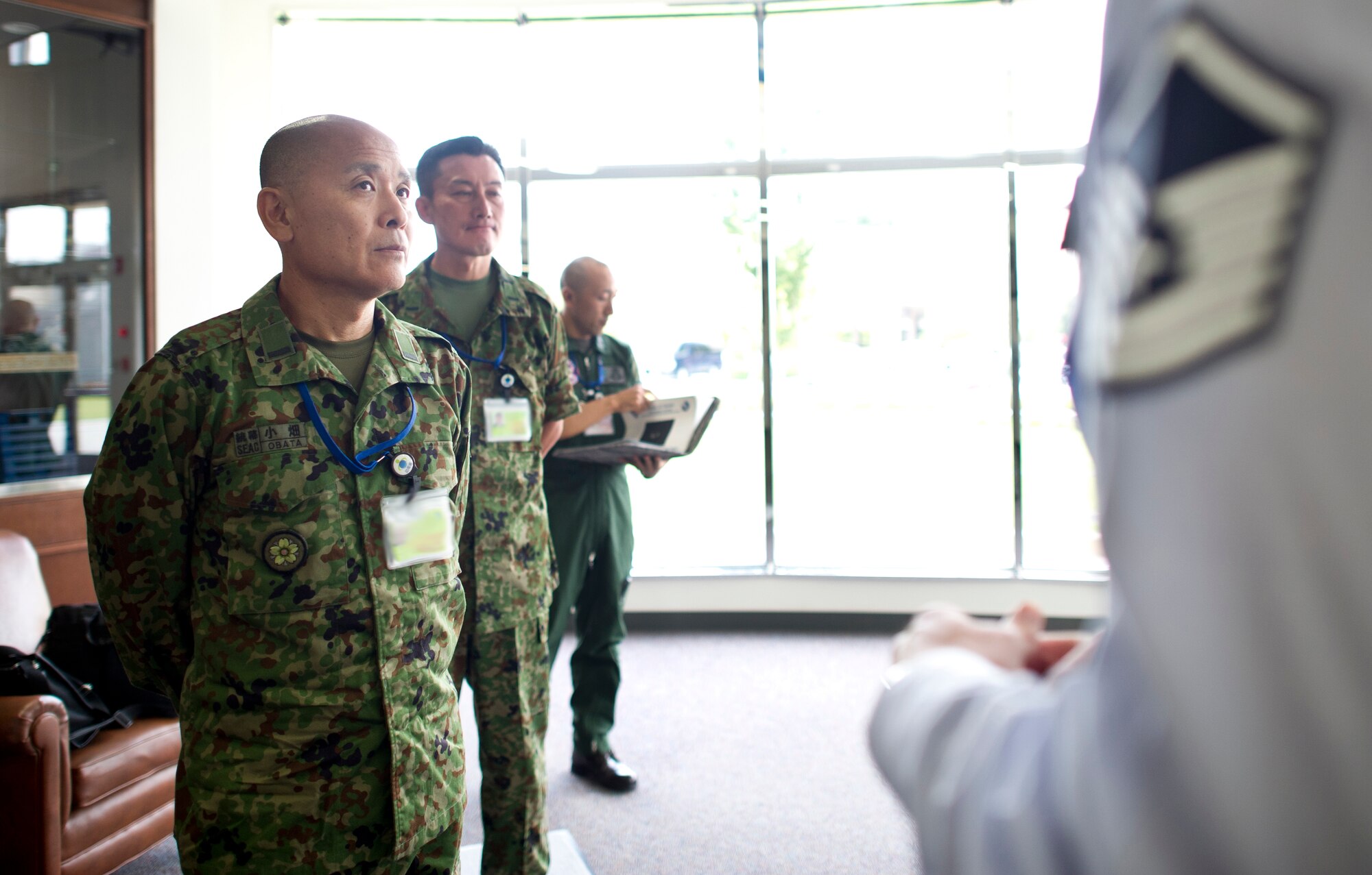 YOKOTA AIR BASE, Japan -- Japan Ground Self-Defense Force Warrant Officer Yoshihiro Obata, Japan Joint Staff Office senior enlisted advisor, speaks with Master Sgt. Daniel Chapman, Career Assistance Advisor, July 22, 2013, at Yokota Air Base, Japan. Obata toured Yokota's Professional Development Center to observe how Yokota develops their enlisted Airmen. (U.S. Air Force photo by Staff Sgt. Stacy Moless)