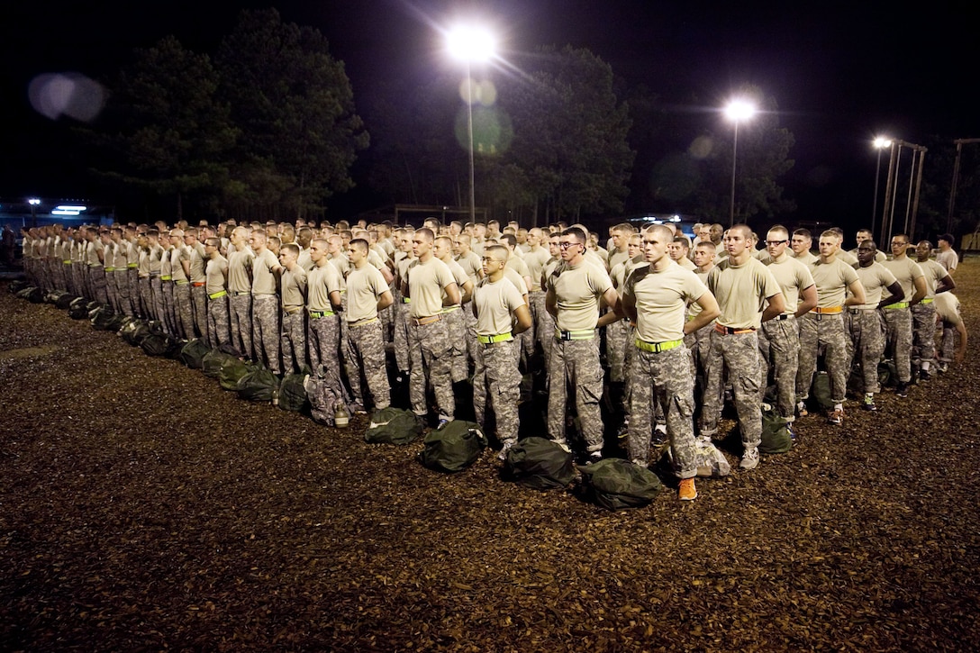 Soldiers and Army cadets stand in formation on the first day of the air assault course at Kirby Field on Fort Benning, Ga., July 14, 2013. The 12-day course consists of three phases: combat assault operations, sling-load operations and rappelling.