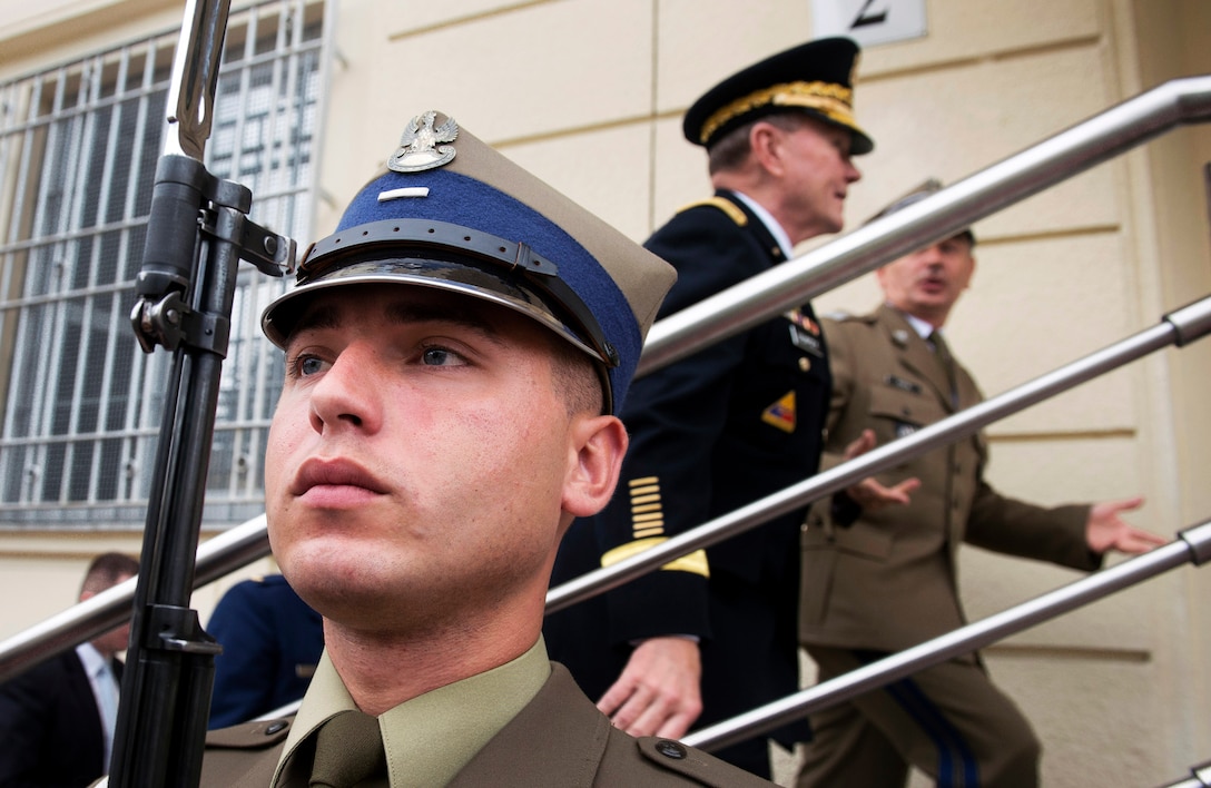 A member of the Polish honor guard stands his post while U.S. Army Gen. Martin E. Dempsey, chairman of the Joint Chiefs of Staff, and Polish Army Lt. Gen. Mieczyslaw Gocul, chief of the General Staff of Poland's armed forces, proceed to their meeting in Warsaw, Poland, July 24, 2013. 