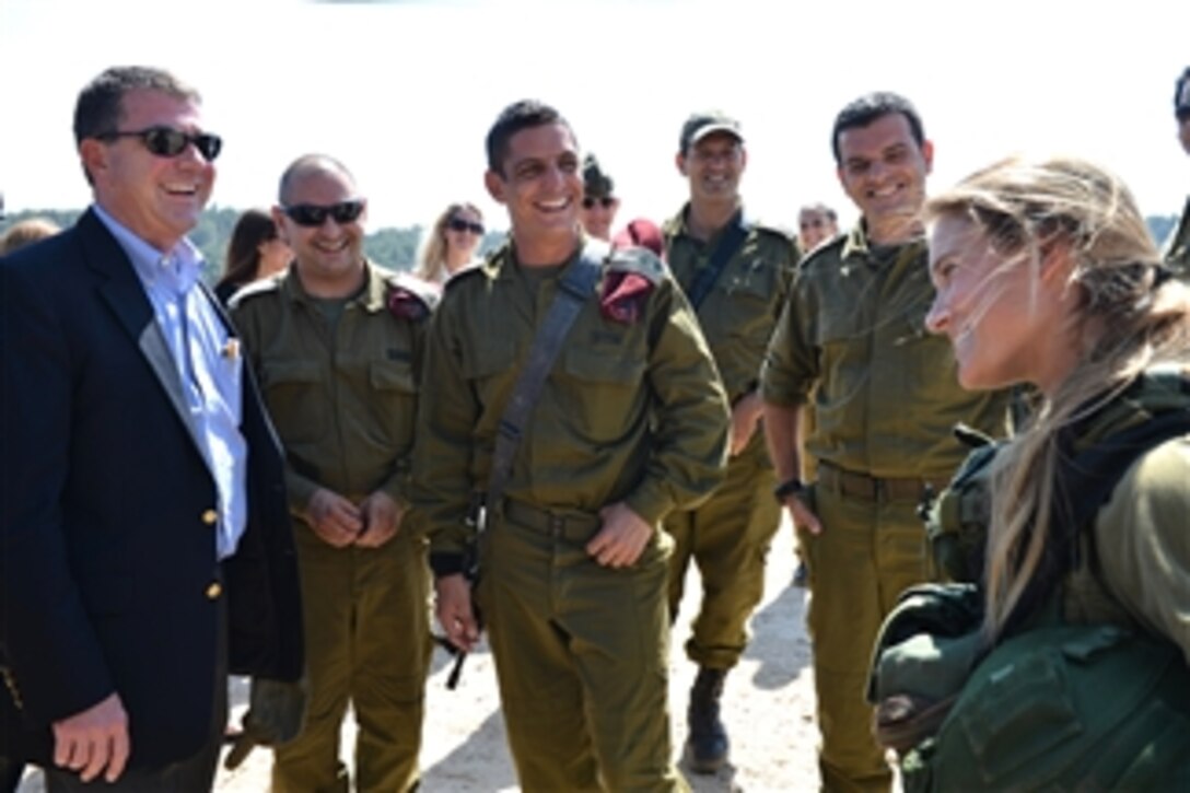 Deputy Secretary of Defense Ashton B. Carter, left, meets with military working dog handlers at the Israel Defense Force Canine Unit at Mitkan Adam Army Base in Israel on July 21, 2013.  Carter is on his first official trip to Israel where he will discuss the situations in Syria and Iran and reaffirm the U.S.-Israeli defense relationship.  