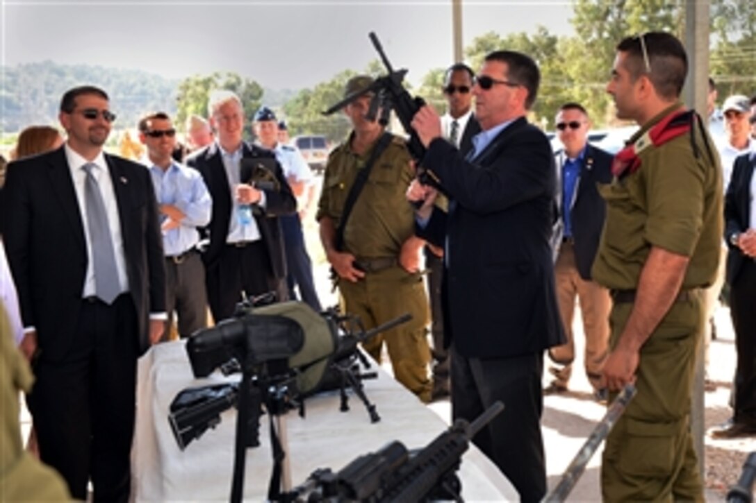 Deputy Secretary of Defense Ashton B. Carter, second from right, examines one of the weapons of the Israel Defense Force at a display at Mitkan Adam Army Base in Israel on July 21, 2013.  Carter is on his first official trip to Israel where he will discuss the situations in Syria and Iran and reaffirm the U.S.-Israeli defense relationship.  