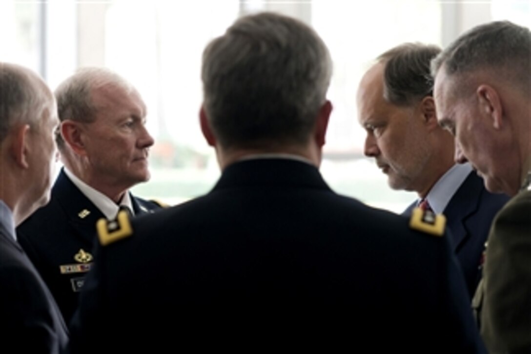 Chairman of the Joint Chiefs of Staff Gen. Martin E. Dempsey, second from left, listens to U.S. Ambassador to Afghanistan James B. Cunningham, second from right, as they have an informal meeting at the Presidential Palace in Kabul, Afghanistan, on July 22, 2013.  Dempsey is in Afghanistan to meet Afghan senior leaders, NATO members, U.S. leadership and U.S. troops deployed there.  