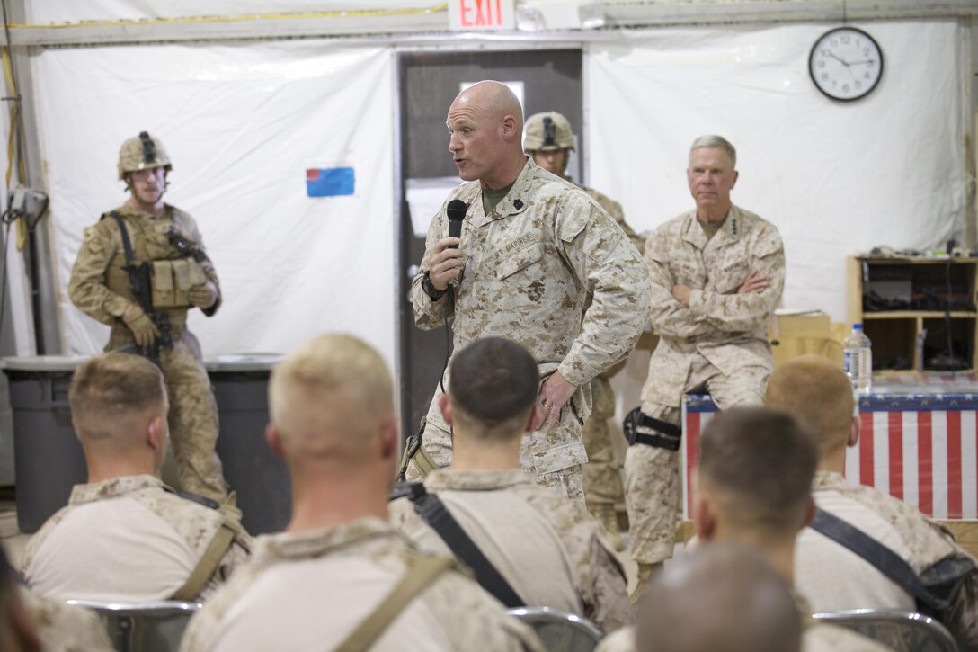 Sgt. Maj. Micheal P. Barrett, the 17th Sergeant Major of the Marine Corps, visits Marines and Sailors during a battlefield circulation at Camp Dwyer, Helmand Province, Afghanistan on June 19, 2013. (U.S. Marine Corps photo by Sgt. Mallory S. VanderSchans)