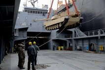 An M1A1 Abrams tank is off-loaded from the USNS 2nd Lt. John P. Bobo April 19 off the shore of Pohang, Republic of Korea. The tank was loaded onto a logistics support vessel for transport to shore. The Joint Integration and Transportability Branch in Marine Corps Systems Command’s Systems Engineering Interoperability Architectures and Technology office works with the Navy to ensure Marines and their systems are able to move smoothly from operations aboard Navy ships directly into operations ashore. 