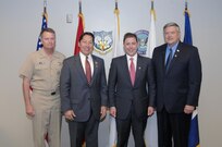 Navy Adm. James Winnefeld, Lionel Rivera, Christian Anschutz and Kevin Estrem pose for a photo during the Commander's Community Leader Commendation Ceremony at NORAD and USNORTHCOM headquarters July 29. 
