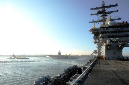 The aircraft carrier USS Dwight D. Eisenhower (CVN 69) departs Naval Station Norfolk ahead of Hurricane Irene. Vice Adm. Daniel Holloway, commander of U.S. 2nd Fleet, ordered all ships in the Hampton Roads area to set Sortie Condition Alpha. Ships in the area are departing early Thursday morning, Aug. 25. Irene's current track indicates it will pass off the North Carolina and Virginia coasts late Saturday as a Category 3 hurricane. 