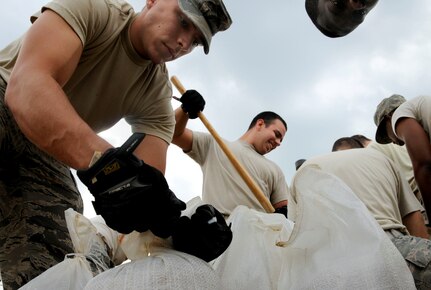 U.S. Air Force Airmen from Public Works fill sand bags at Joint Base Anacostia-Bolling, D.C., Aug 25 in preperation for Hurricane Irene. Hurricane Irene is expected to hit the U.S. east coast over the weekend and may bring heavy winds and flooding. 