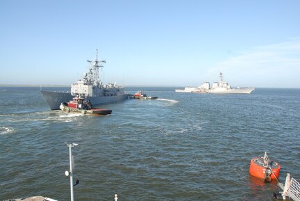 The Arleigh Burke-class guided-missile destroyer  USS Oscar Austin (DDG 79) and the guided-missile frigate USS Nicholas (FFG 47) depart Naval Station Norfolk in advance of Hurricane Irene.  Vice Adm. Daniel Holloway, commander, U.S. Second Fleet, ordered Sortie Condition Alpha so the ships could avoid storm damage. Irene’s current track indicates it will pass off the Virginia and North Carolina coasts overnight Saturday as a category II hurricane. 
