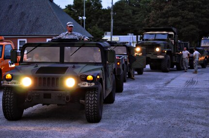 Virginia National Guard Soldiers from the West Point-based 237th Engineer Company prepare for possible duty in response to Hurricane Irene in Onancock August 26 by staging vehicles, equipment and fuel. The Virginia National Guard has been authorized to bring up to 300 personnel on state active duty for possible missions including high water transport and light debris removal. 