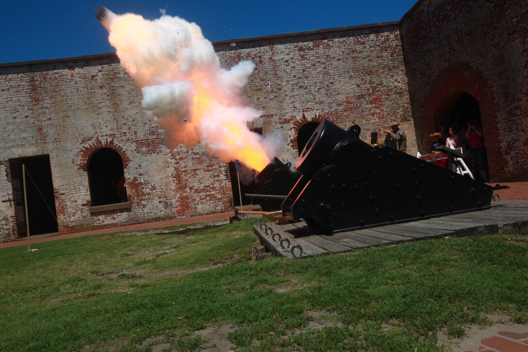 Civil War reenactors at Fort Macon State Park fire a cannon Saturday. A volunteer with the 1st North Carolina Volunteers/11th North Carolina State Troops Civil War Reenactment Regiment explained the responsibilities of each the five members required to fire the cannon.

