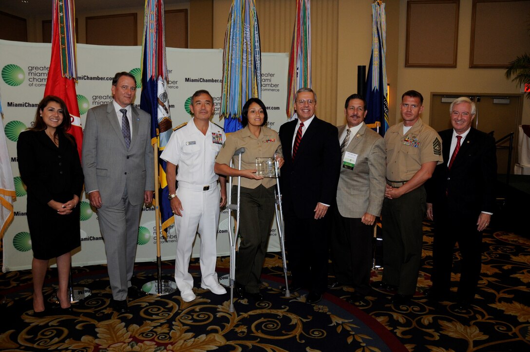 Sergeant Aisha S. Shapiro Kinghorn, an administrative clerk with U.S. Marine Corps Forces South, poses for a photo after receiving an award for her volunteer service to the Greater-Miami community. The Chamber’s board of trustees selected service members for the award based off of their individual accomplishments and volunteer service to the Miami community. (Official U.S. Marine Corps photo by SSgt. Earnest J. Barnes/Released)