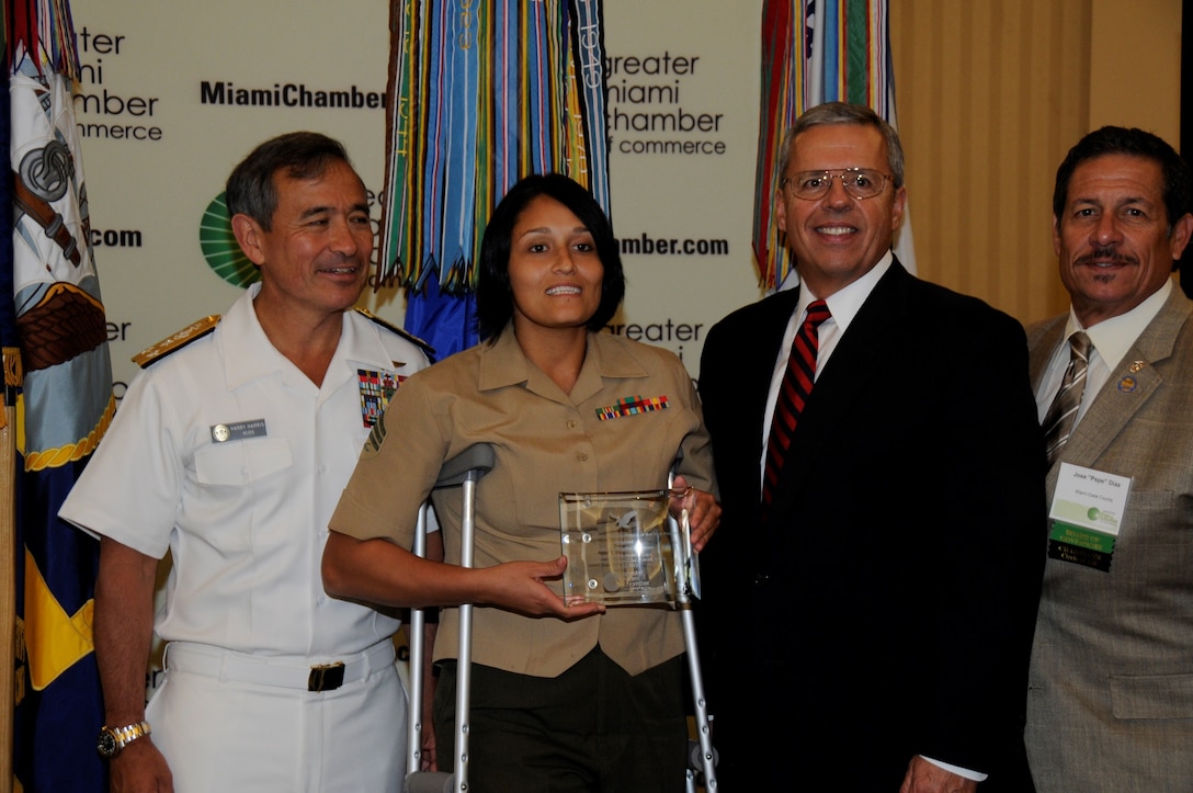 Sergeant Aisha S. Shapiro Kinghorn, an administrative clerk with U.S. Marine Corps Forces South, poses for a photo after receiving an award for her volunteer service to the Greater-Miami community. The Chamber’s board of trustees selected service members for the award based off of their individual accomplishments and volunteer service to the Miami community. (Official U.S. Marine Corps photo by SSgt. Earnest J. Barnes/Released)