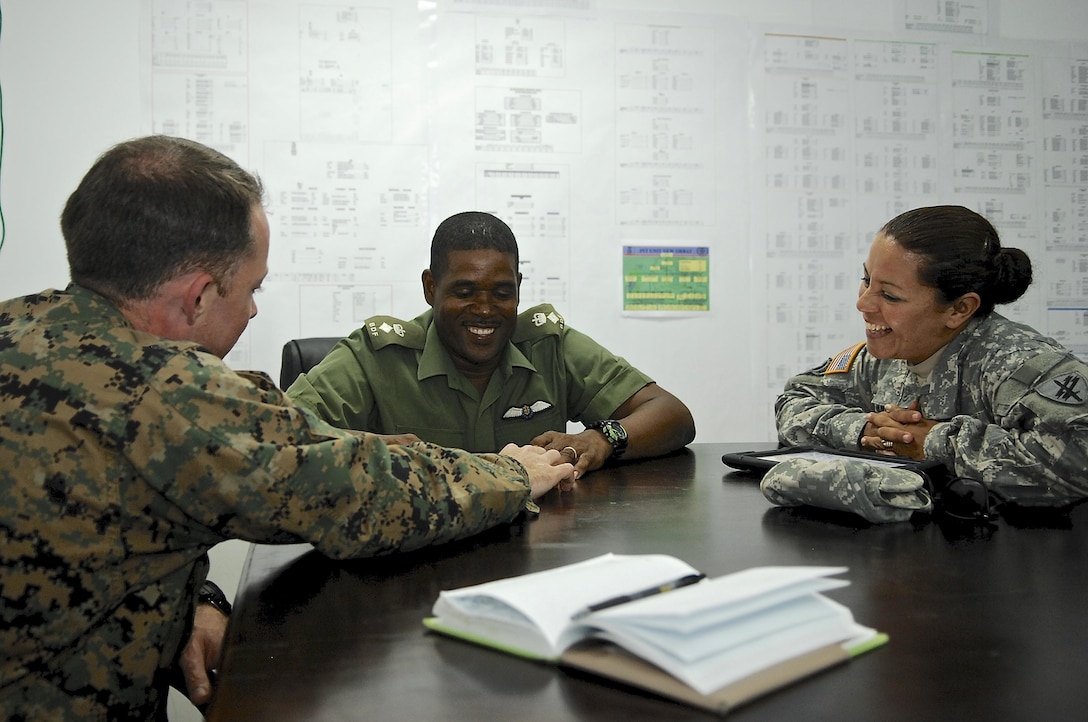 Civil affairs service members from the U.S. Army and Marine Corps meet with Belize Defense Force Chief of Staff Lt. Col. Raymond Shepherd, May 6,  to discuss ongoing projects. The civil affairs team meets with key leaders and local communities to assess host-nation capabilities as part of exercise New Horizons. (U.S. Air Force photo by Master Sgt. James Law//Released)