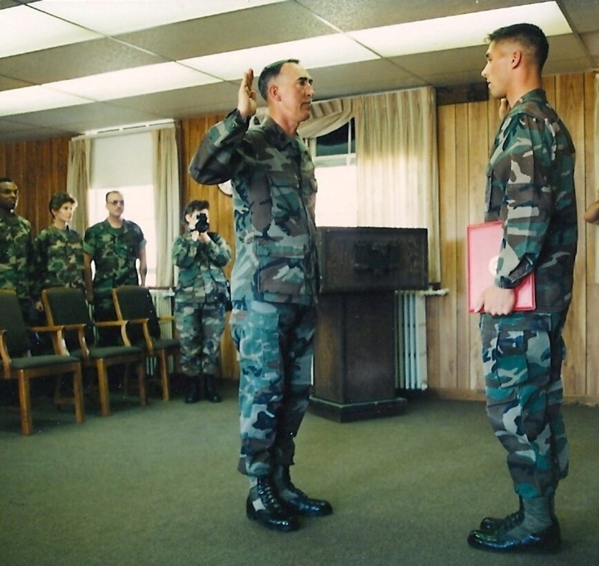 Col. Sean M. Magee, who currently serves as the deputy chief of staff plans for Joint Enabling Capabilities Command, is pictured officiating his father's reenlistment ceremony more than 20 years ago. Sgt. Maj. Michael D. Magee and his son are active volunteers with the Southeast County Young Marines.
