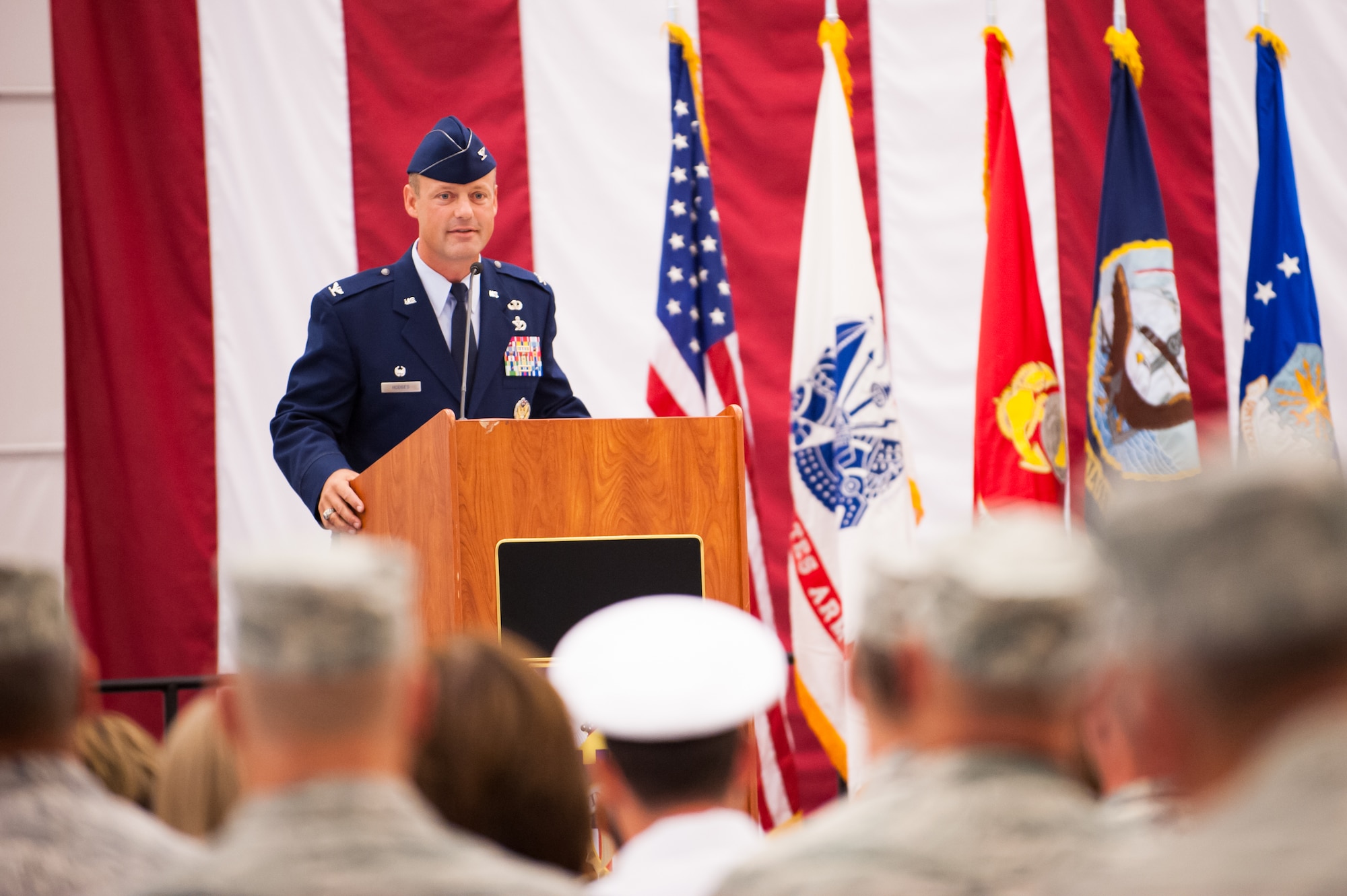 Col. James C. Hodges, 87th Air Base Wing and Joint Base McGuire-Dix-Lakehurst commander, addresses the service members and civilians assigned to the wing during a change of command ceremony, July 25, 2013, in Hangar 2201 on Joint Base McGuire-Dix-Lakehurst, N.J. (U.S. Air Force photo by Russ Meseroll/Released)
