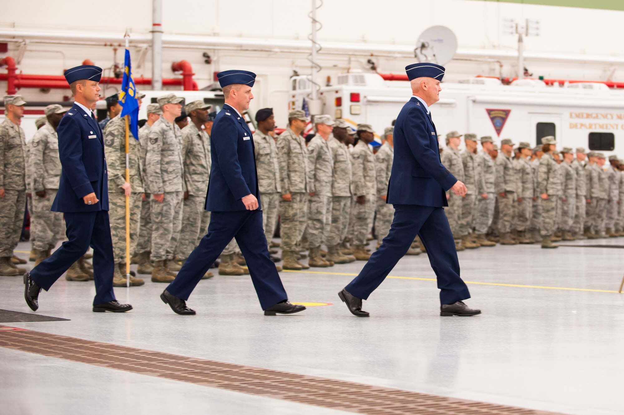 (From left to right) Col. James C. Hodges, Col. John M. Wood, 87th Air Base Wing and Joint Base commander, and Brig. Gen. Randall C. Guthrie, U.S. Air Force Expeditionary Center commander, enter the 87th Air Base Wing Change of Command Ceremony July 25, 2013, in hangar 3370 on Joint Base McGuire-Dix-Lakehurst, N.J. During the event Wood relinquished command to Hodges. (U.S. Air Force photo by Russ Meseroll/Released)