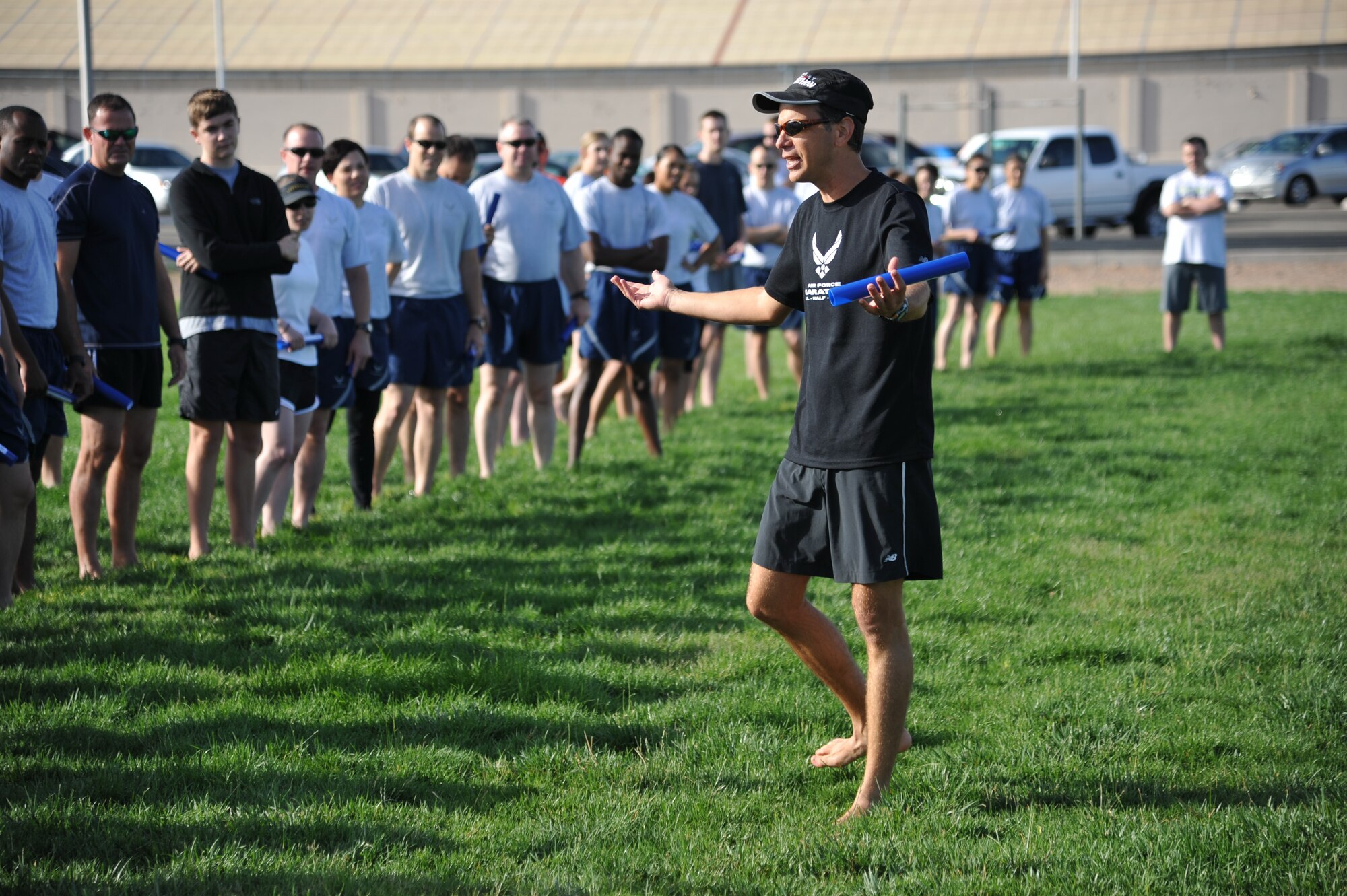 Dr. Antonio Eppolito, five-time Air Force half marathon champion, teaches proper running form to participants of the running clinic.. The free clinic was hosted by the Health and Wellness Center. (Photo by Ken Moore)