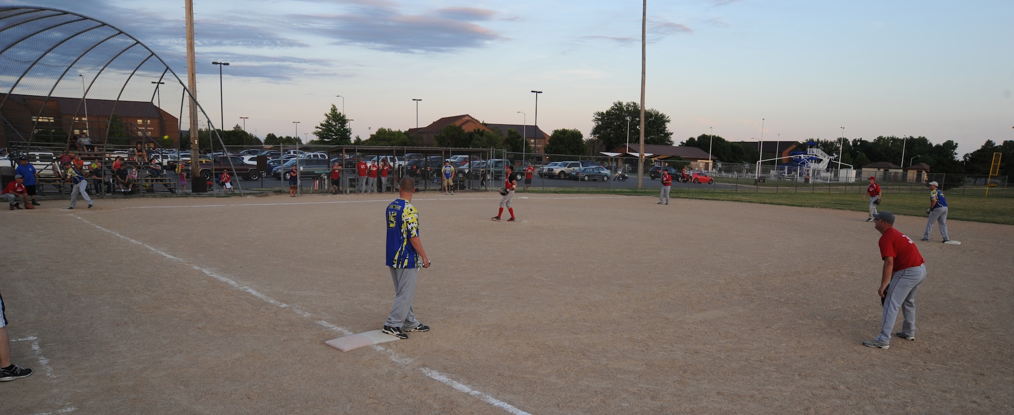 Members of the Civil Engineering softball team face off against the Security Forces-A softball team at Whiteman Air Force Base, Mo., July 22, 2013. CE won the game 16-6, claiming first place in the base league. (U.S. Air Force photo by Airman 1st Class Bryan Crane/Released)