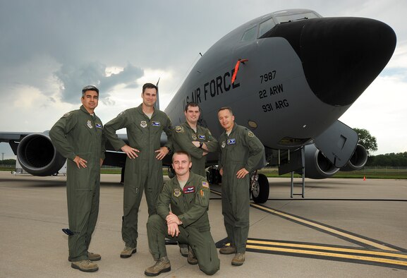 (Standing, from left to right) Maj. Chris Brockman, 22nd Operations Group KC-135 Stratotanker Block 45 program chief pilot, Maj. Scot Stewart, 22nd OG Pilot, Capt. Travis Neal, 22nd OG instructor pilot, Lt. Col. Eugene Croft, 22nd OG deputy commander, and (kneeling) Senior Airman Josh Garrett, 350th Air Refueling Squadron Boom Operator, pose in front the wing’s first block 45 KC-135 Stratotanker to take off from here, July 22, 2013, at McConnell AFB, Kan. Block 45 is a program that addresses critical obsolete aircraft equipment and safety of flight issues. (U.S. Air Force photo/Airman 1st Class Jose L. Leon)
