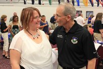 Brig. Gen. Robert LaBrutta, commander, Joint Base San Antonio and 502nd Air Base Wing speaks with a military spouse during the Joint Base San Antonio Spouse Appreciation Social July 20 at JBSA-Fort Sam Houston Community Center. The event was held to thank military spouses from across JBSA. Unit first sergeants and chief petty officers from the Army, Navy, and Air Force nominated those spouses who have distinguished themselves for their unselfish contributions to service members and families’ quality of life. The event was attended by senior leaders from across the joint base. Music was provided by the Band of the West and attendees had the opportunity to learn about programs tailored to benefit military families. 

