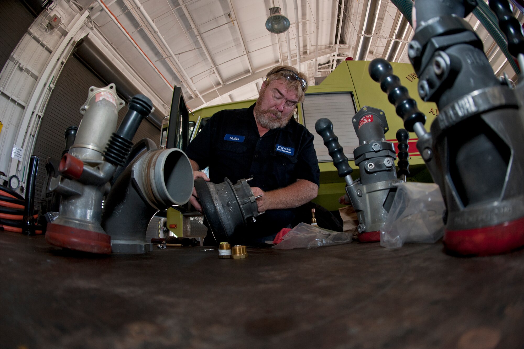 ALTUS AIR FORCE BASE, Okla. – Steve Solls, 97th Logistics Readiness Squadron fire truck and refueling maintenance shop supervisor, prepares a moose-head cylinder for installation on a R-12 refueling vehicle during a routine maintenance inspection inside the vehicle maintenance shop, July 23. The cylinder ensures proper function of the refueling vehicle’s valves to safely transfer fuel to hot pits and aircraft. (U.S. Air Force photo by Senior Airman Dillon Davis/Released)