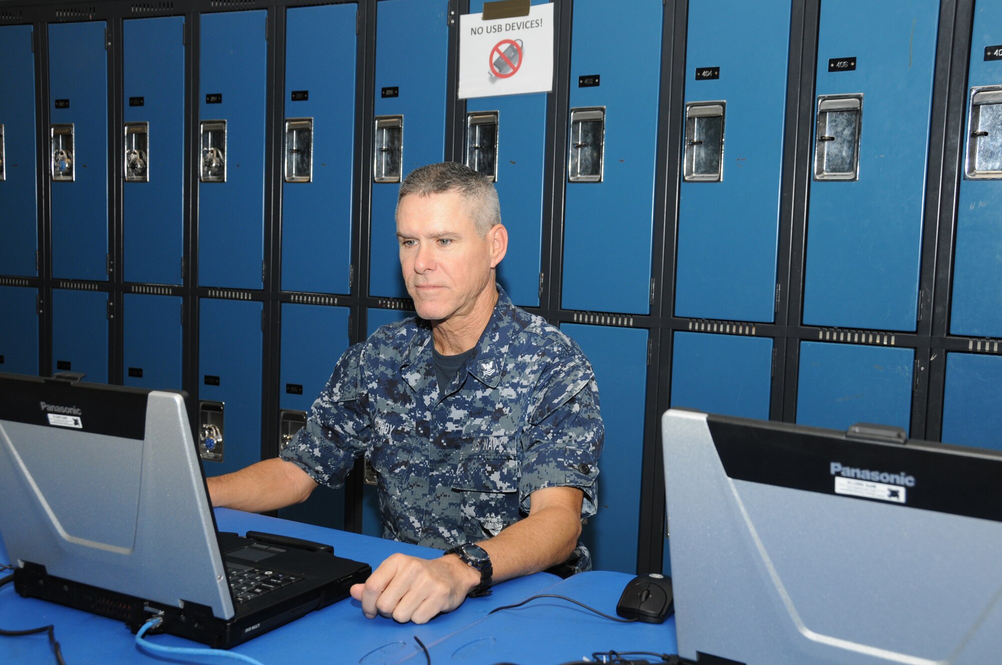 U.S. Navy Corpsman 2nd Class Gregory Derby, conducts research using an internet connection provided by 280th Combat Communications Squadron, Alabama Air National Guard during the Hope of Martin Innovative Readiness Training (IRT) at Martin Middle School in Martin, Tenn., July 15. Derby, along with more than 130 other Air National Guard, Army, Air Force and Navy Reserve and active duty Navy, are participating in the Hope of Martin community outreach project. (U.S. Air National Guard photo by Master Sgt. Carlos J. Claudio/Released).
